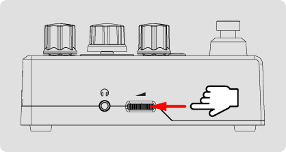 The left panel's Volume thumbwheel is being turned to minimum before making any connections.